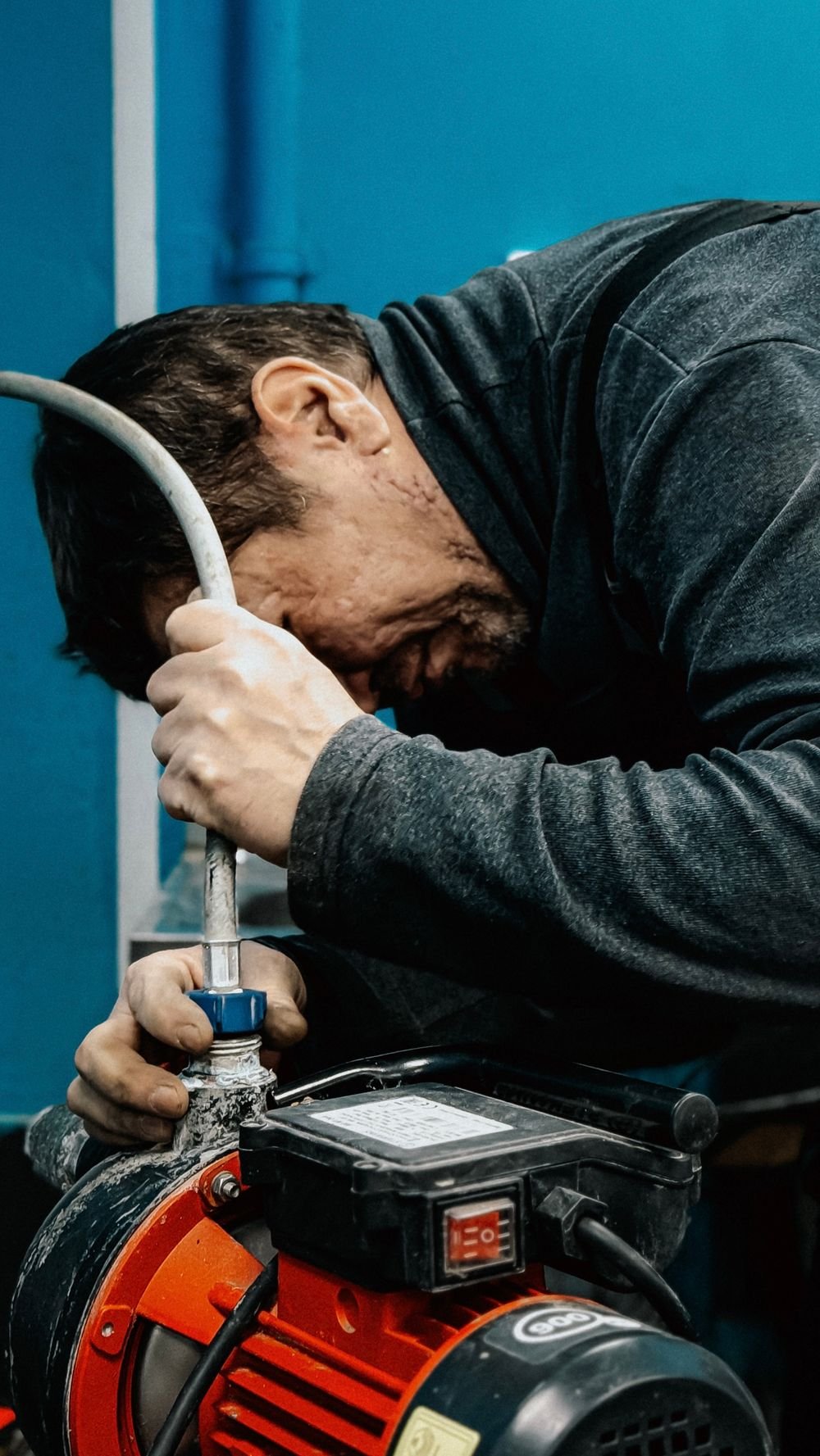 Technician adjusting a water pump