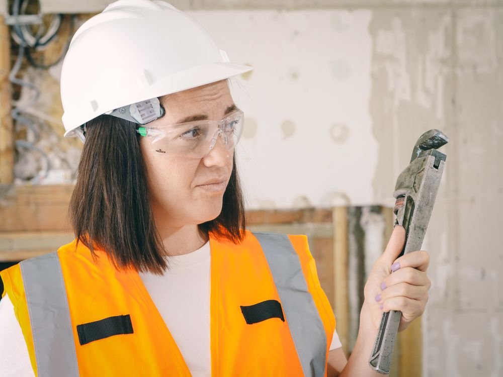 Plumoras technician in protective gear